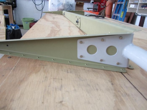 Rudder horn riveted to E-709 and E-702 spar.