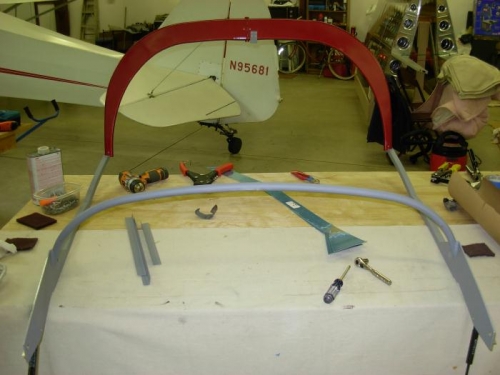 Primed frame and attached latch handle stop