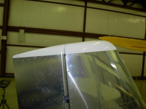 Top fairings to vertical stabilizer and rudder.
