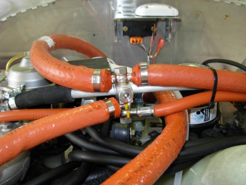 Fuel return assembly