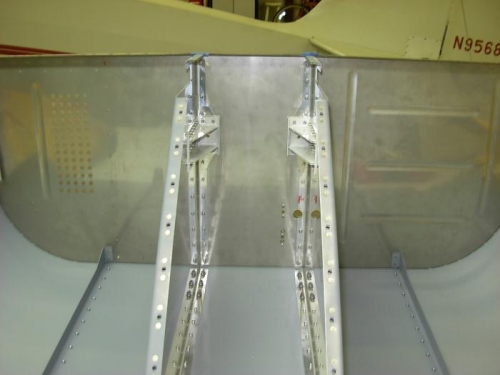 Riveted tunnel ribs to firewall