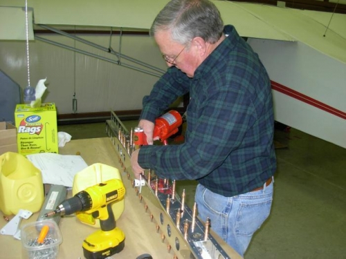 Working on the rivets on main spar.