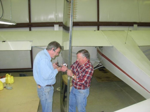 Randy Boland helping hold the horizontal stabilizer after today's work is completed.
