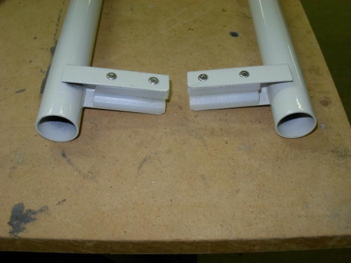 Spacers riveted to flaperon torque tubes