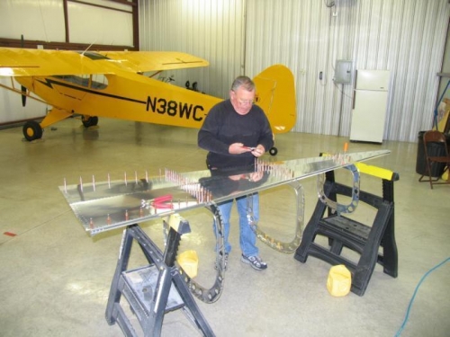 Preparing to attach ribs to bottom fuselage skin.