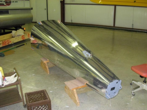 Finished riveting skin to fuselage ribs