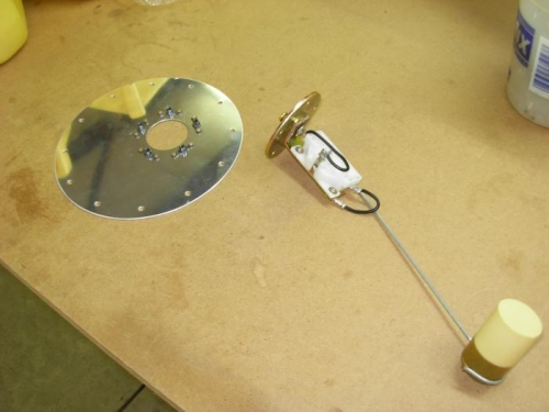 Sender plate and float arm