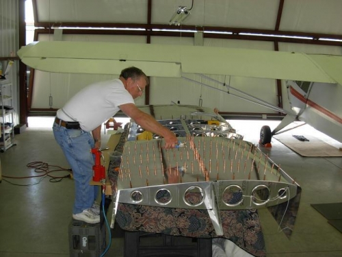 Riveting outboard panel.
