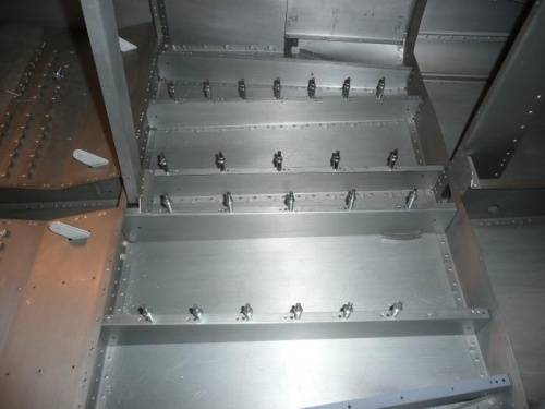 Installing nutplates for baggage floor