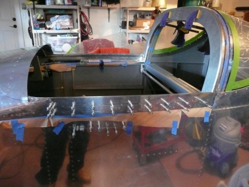 Fitting side skins to rails