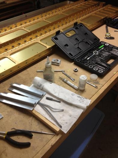 Tapped tie down plates