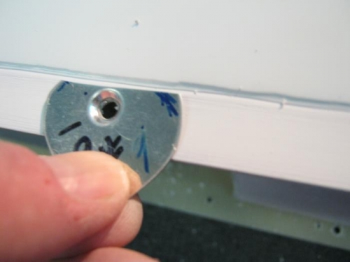 Testing depth of screw countersink with dimple gauge