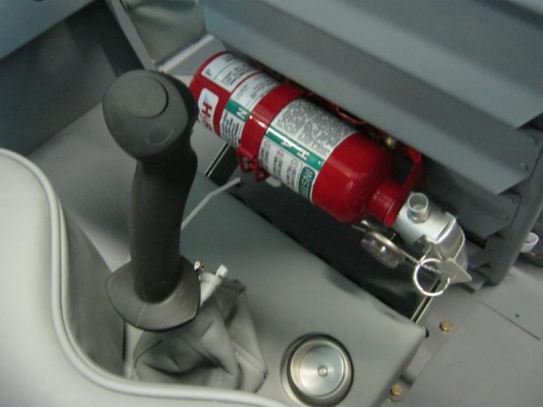 Fire extinguisher mounted to back of front seat