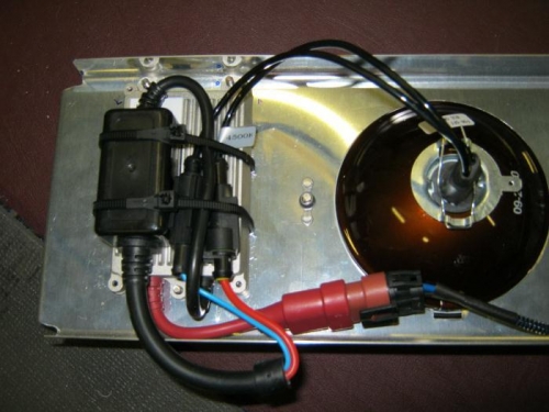 Ballast cable tied to wires and mounted on rear of light mount