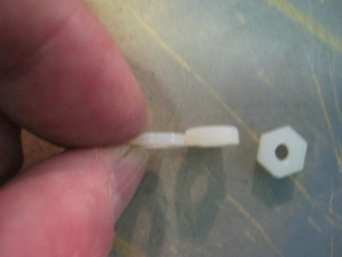 2 no.8 nylon washers glued together compared to thickness of a single nylon nut. These are my spacers