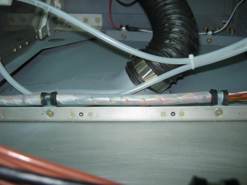EMS wiring secured under the baggage shelf brace