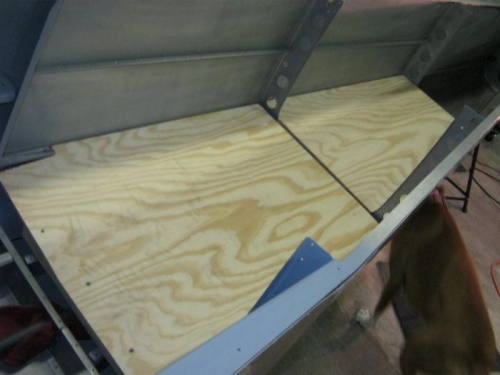 Temporay plywood floor in place in tail cone