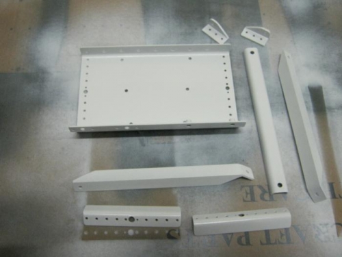 battery tray mounting parts painted with white enamel