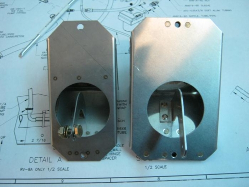 stainless steel TG-10 left aluminum right. Note size difference