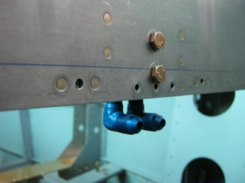 Baggabe side view with bolts. Note the center bottom rivit hole.