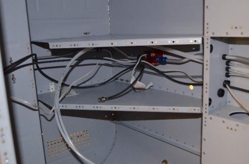 Cables routed under panel