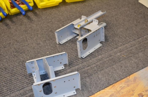 Pully bracket and flapperon assembly