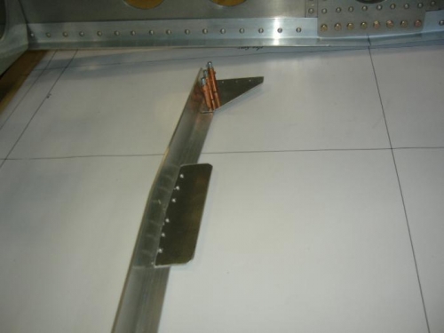 Bracket attached to longerons