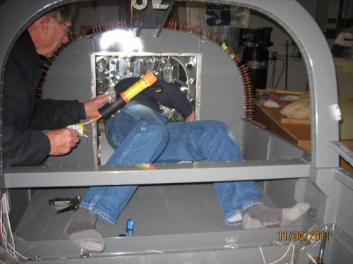 Chris installing cabling