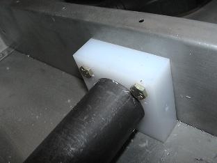 Mounted to the Baggage floor rib