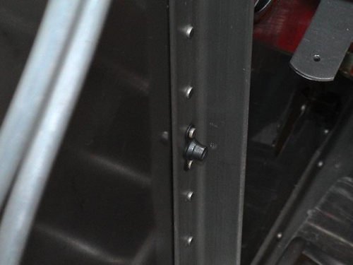 Nut plate on the rear of firewall.