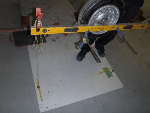 level with two plumb bobs on template