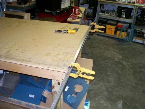 Longeron clamped to the table for counter sinking