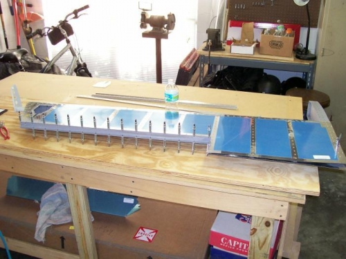 L. Elevator spar riveted on to skin