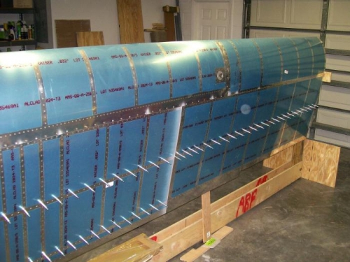 Right wing with top skins on and only J-stringer and rear spar left to rivet