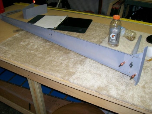 Lower nut plate on wrong side of spar.