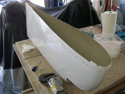 Flange ccut off tip and used for a spacer on the wing side hinge