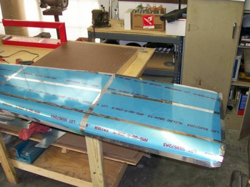 Working on de-blueing the side skin with a soldering iron.