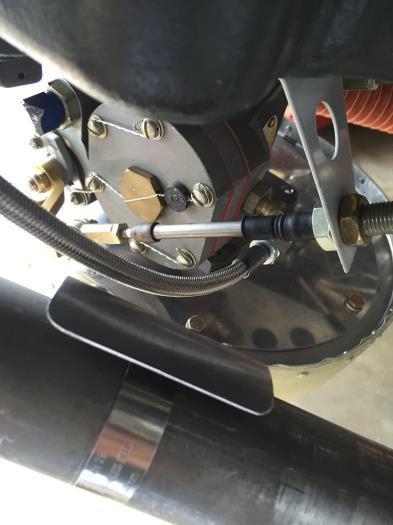Fule line routing past throttle linkage