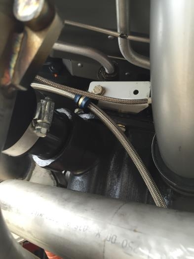 Bracket in place holdinf line off engine