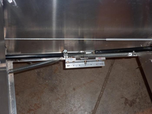Trim system attached to idler arm on elevator control rods.