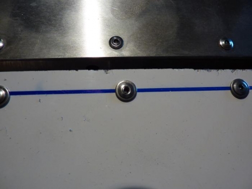 Thin stainless washers under rivets