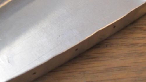 Flutes between rivet holes