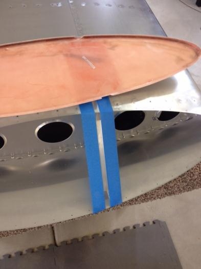 Taping edge of wing tip angle bracket