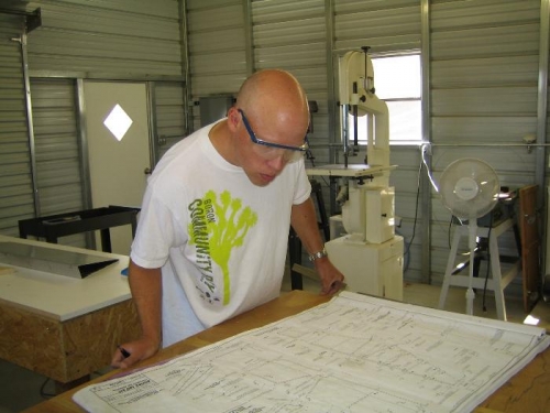 Dean reviewing plans