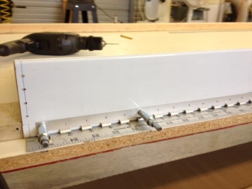Drilling hinges on left flap - using steel ruler as guide