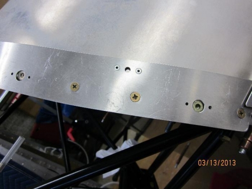 Flush screws on windshield strap