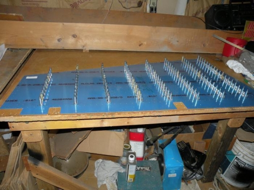 Stiffeners drilled to inside of R-901-R right rudder skin.