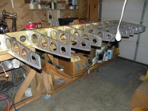 The first thirteen main ribs riveted to the left main spar.