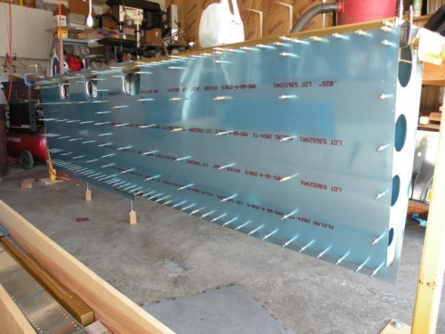 Botom left main skins clecoed in place and ready for final reaming.