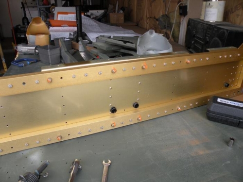 The two inboard seat ribs riveted to aft F-704 bulkhead.